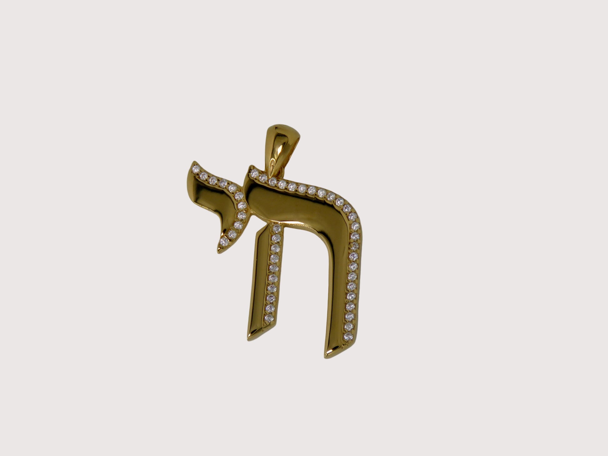 Gold pendant with Hebrew letter 'He' on a gray background